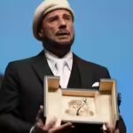 John Travolta tears up over honorary Palme d’Or at Cannes Film Festival; makes directorial debut with ‘Propeller One-Way Night Coach’