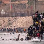 Footage shows chaos at Spain-Morocco border as thousands try to swim across; 34 dead